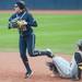 Michigan junior Lyndsay Doyle makes the play at sound getting Iowa's Michelle Zoeller out for the double play during the fifth inning. 
Courtney Sacco I AnnArbor.com  